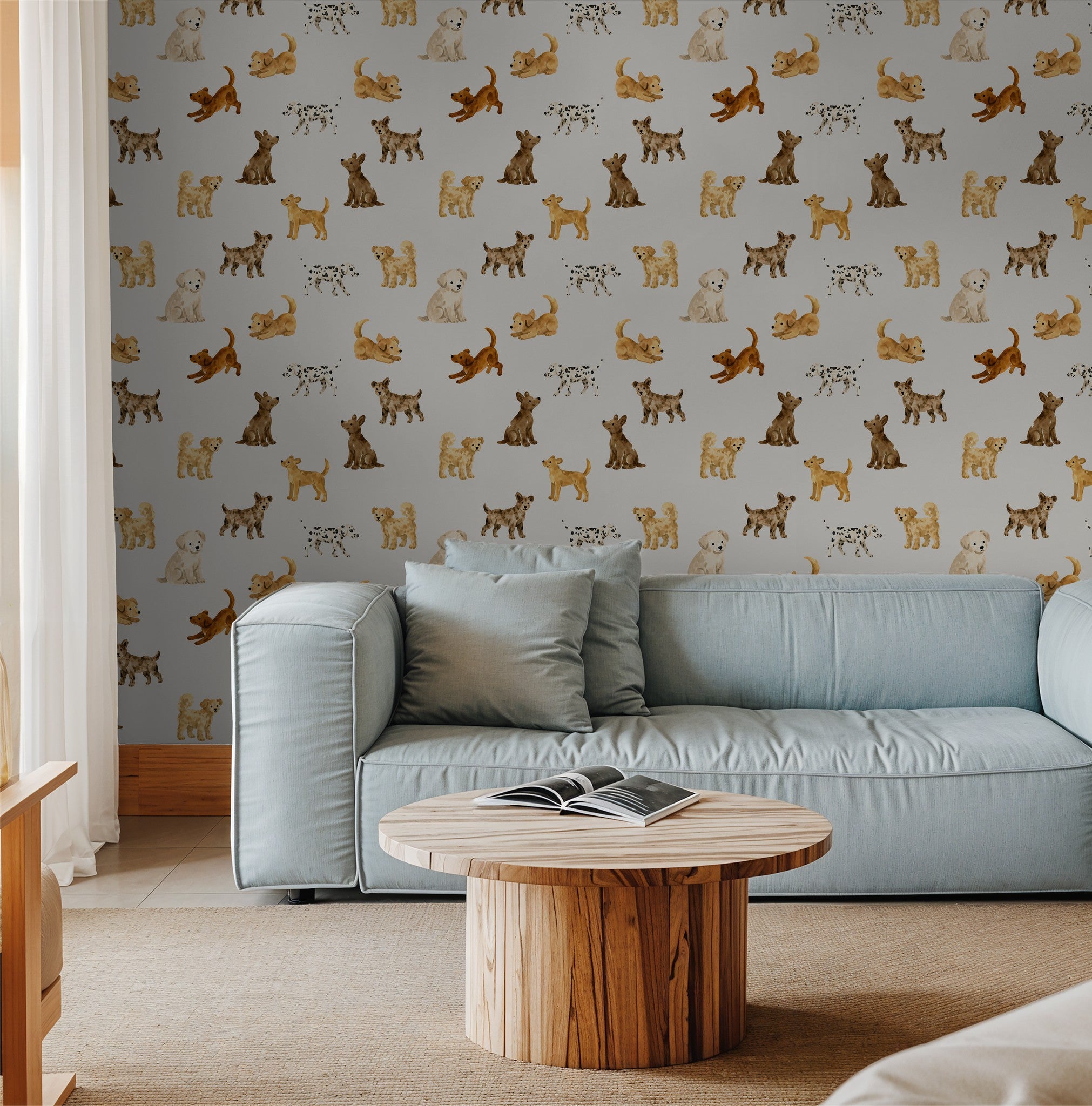 Playful dog pattern wallpaper in cozy living room with blue sofa and wooden table.