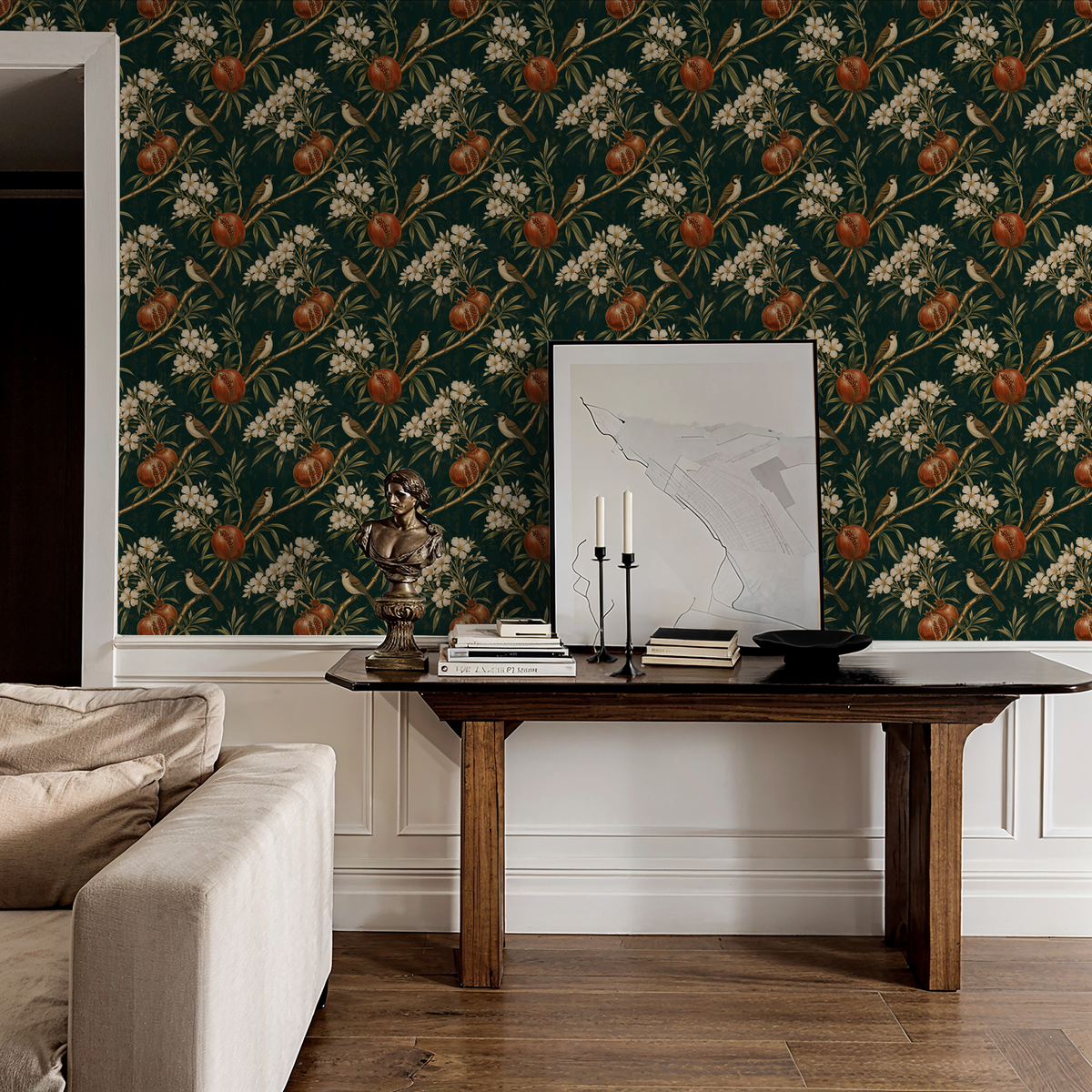 Pomona wallpaper with birds and pomegranates in green and earthy tones in elegant living room.