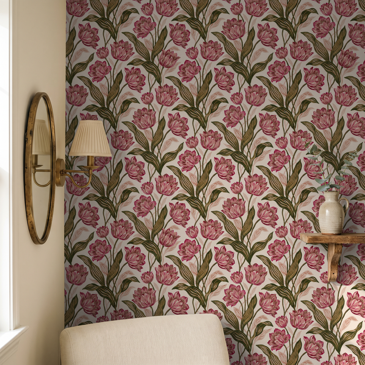 Floral pink and green wallpaper in a cozy room with a mirror and vase.