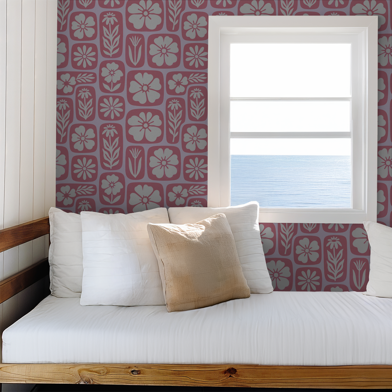 Retro floral wallpaper with pink and white motifs in a cozy room with ocean view.