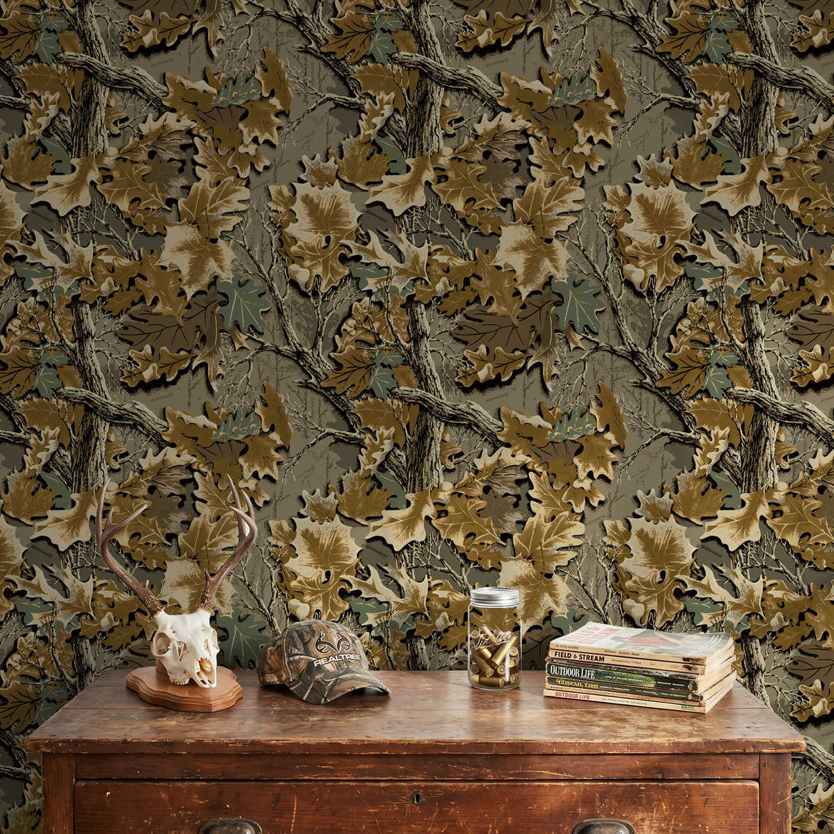 Rustic autumn foliage wallpaper with earthy browns and greens in a cozy room setting.
