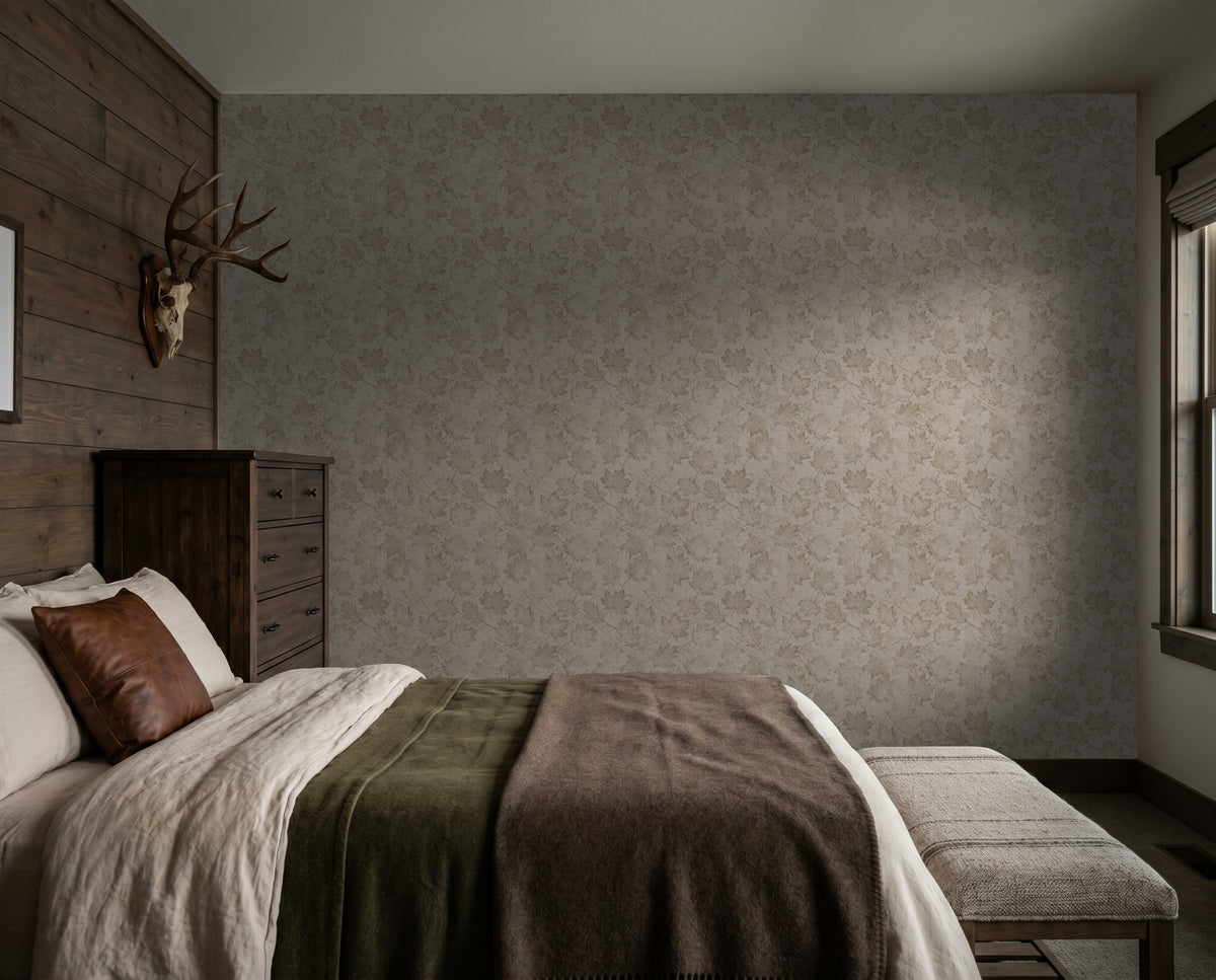 Sepia-toned leaf pattern wallpaper in a rustic bedroom with wooden accents.