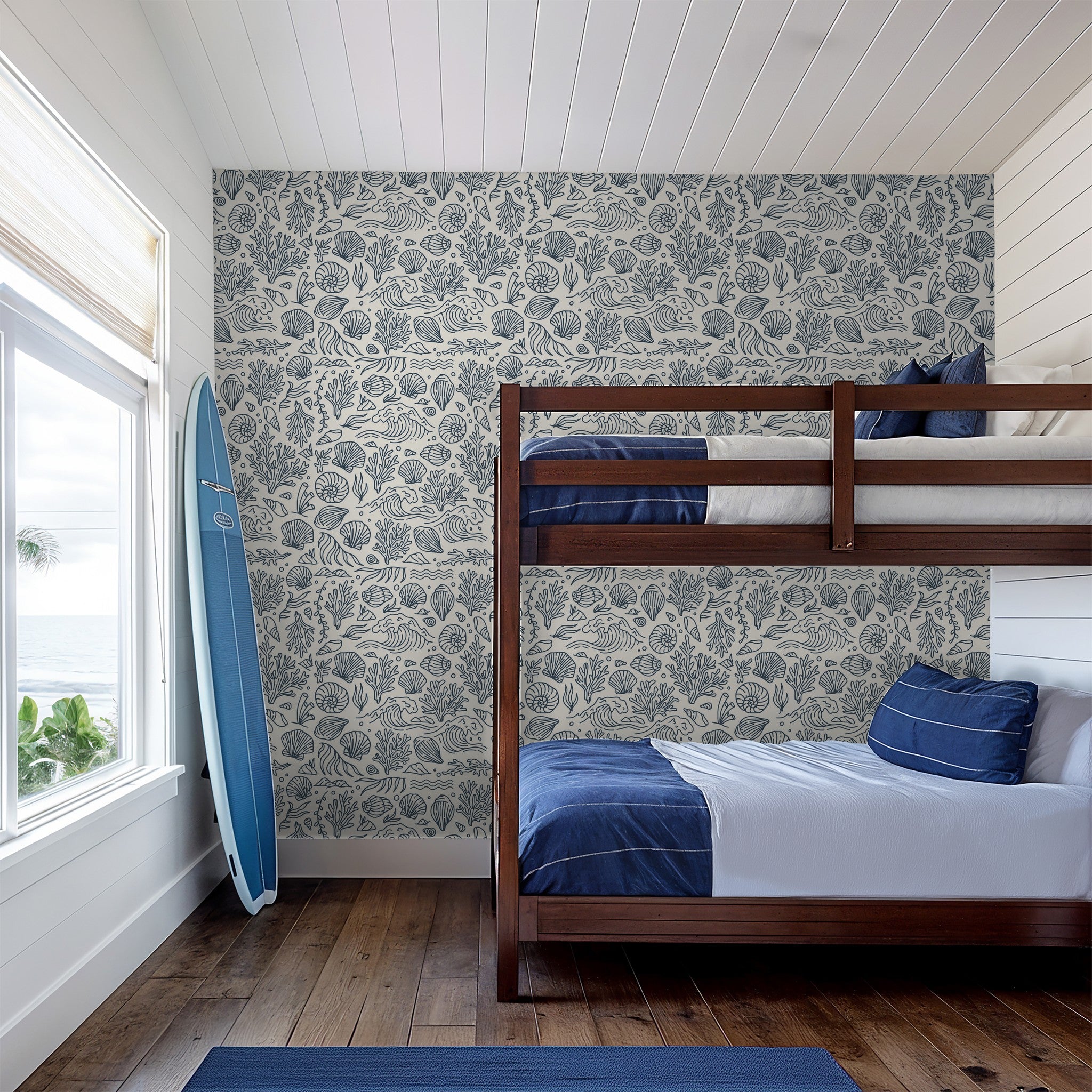 Coastal slate blue and cream wallpaper in nautical-themed bedroom with bunk beds.
