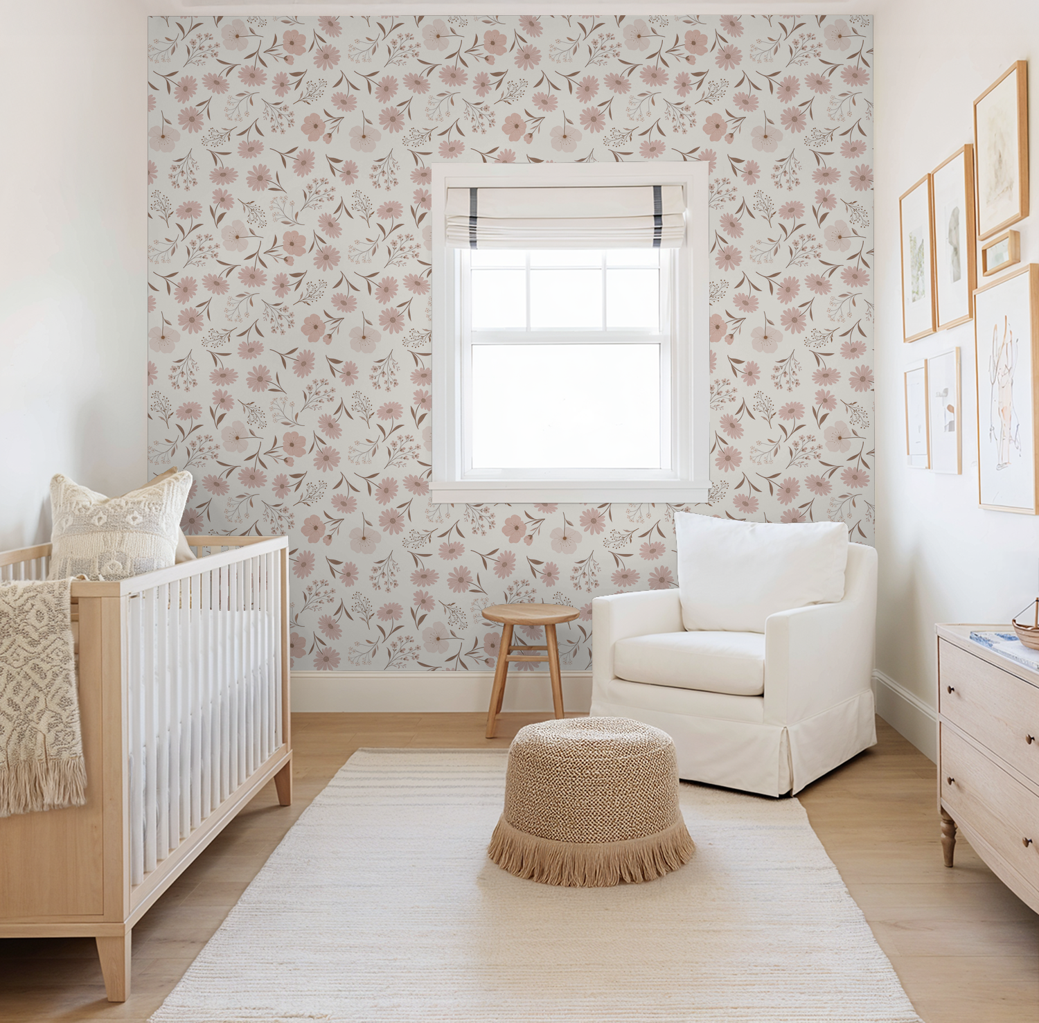Soft floral blush wallpaper in a serene nursery with crib and armchair.