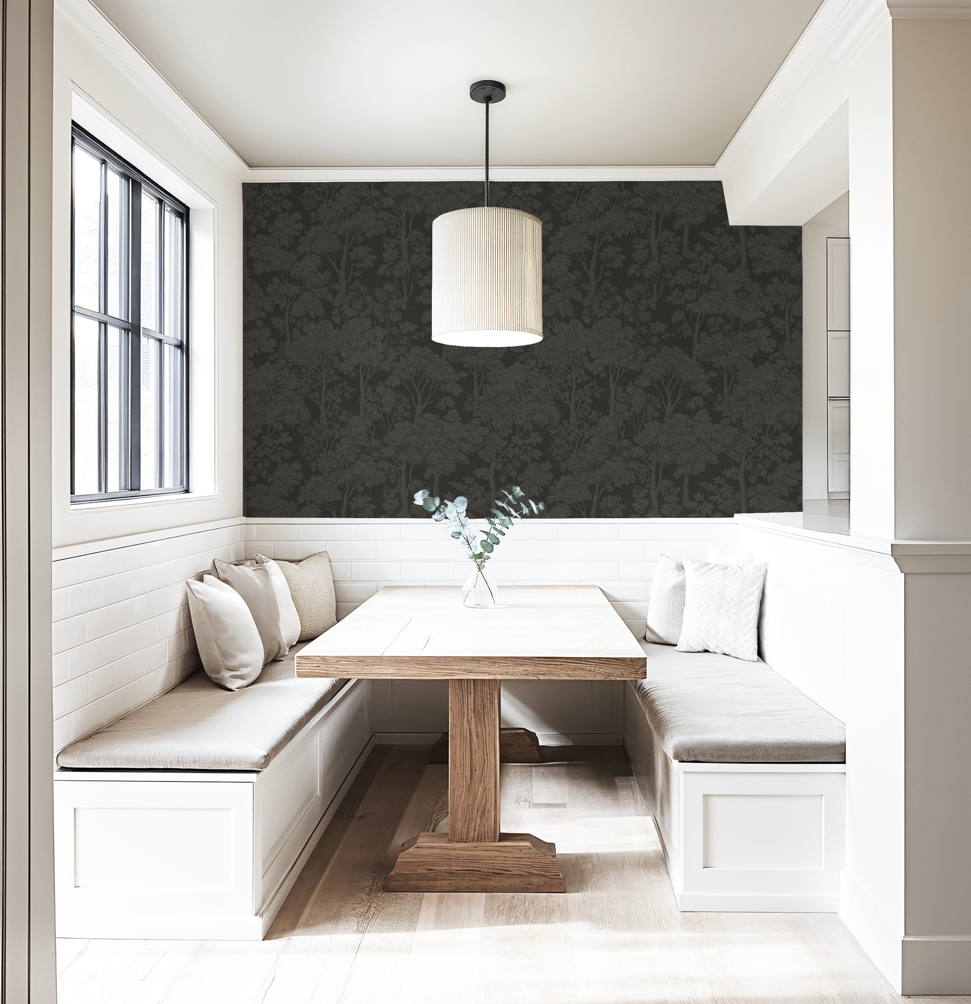 Taupe tree silhouette wallpaper in cozy dining nook with wooden table.