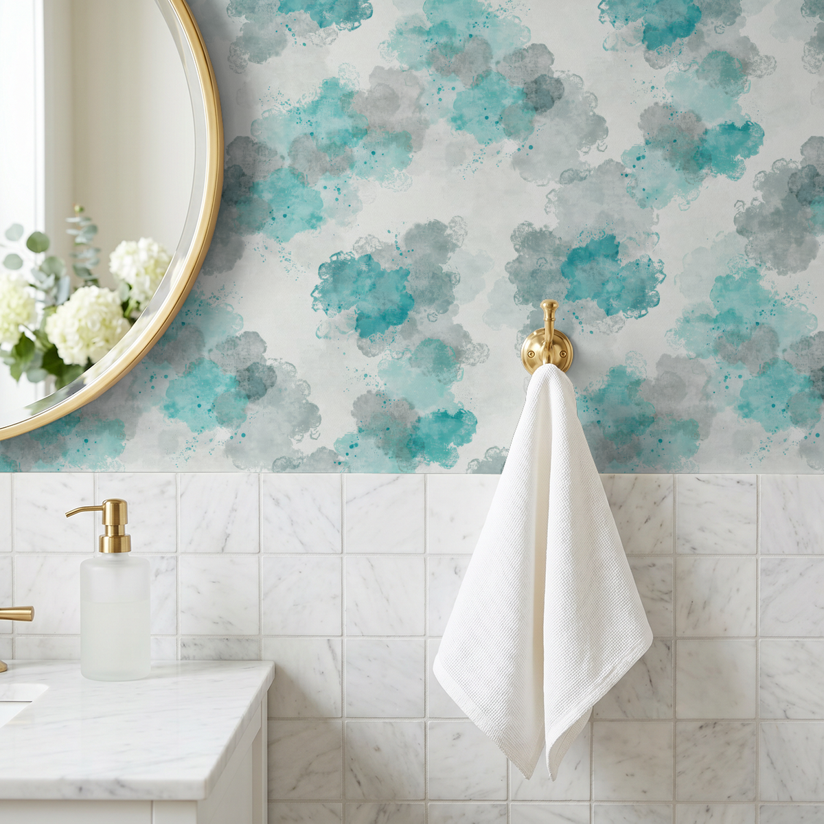 Teal watercolor cloud wallpaper in bathroom with white tiles and gold accents.