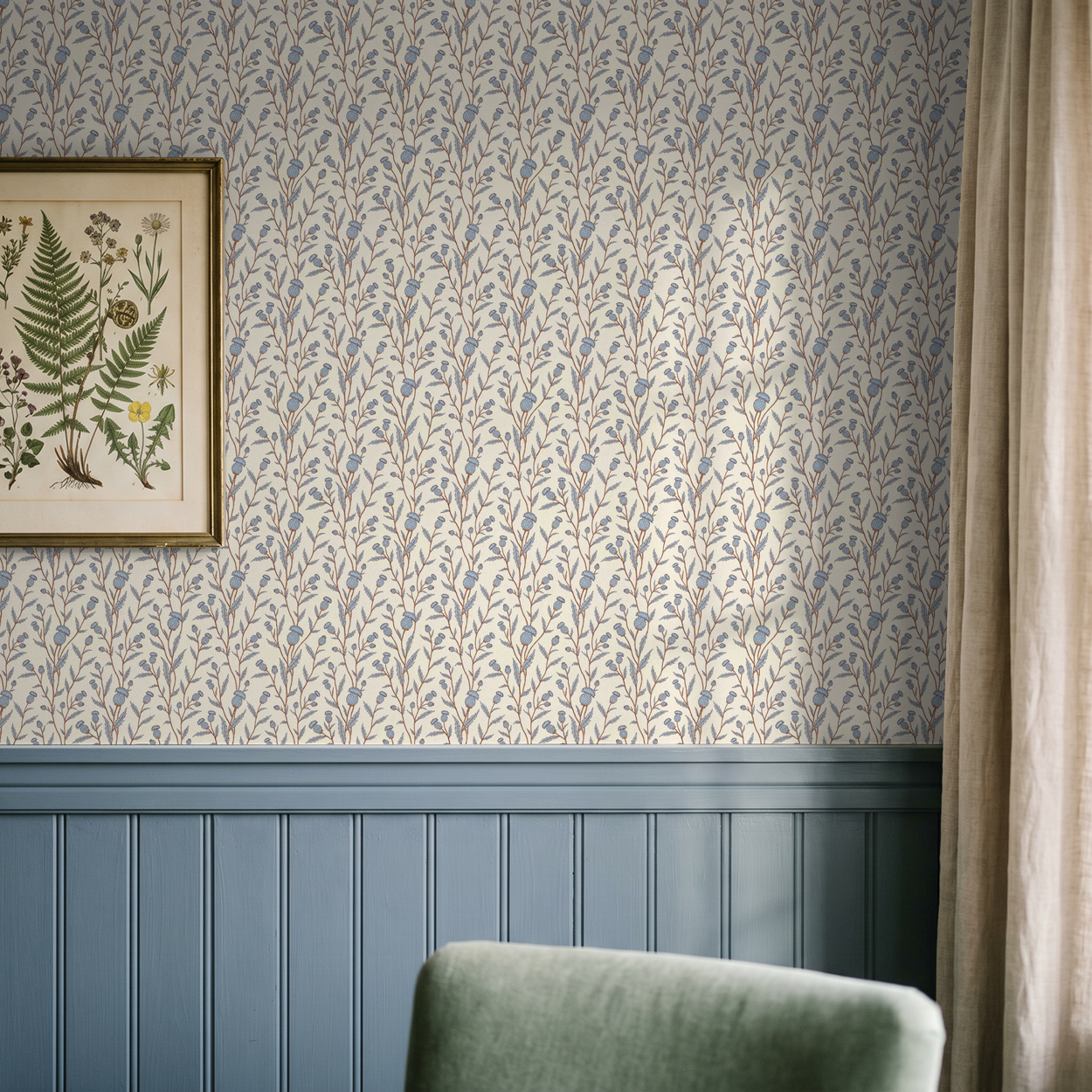 Thistle motif wallpaper in blue and brown with botanical art in a cozy room.