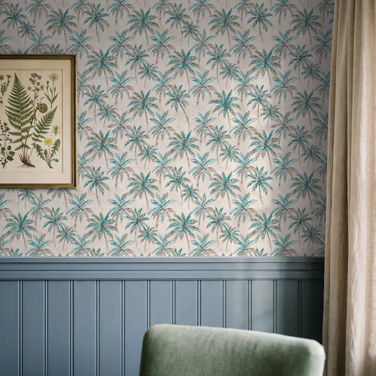 Tropical palm tree wallpaper in turquoise and brown with framed botanical art and blue wainscoting.
