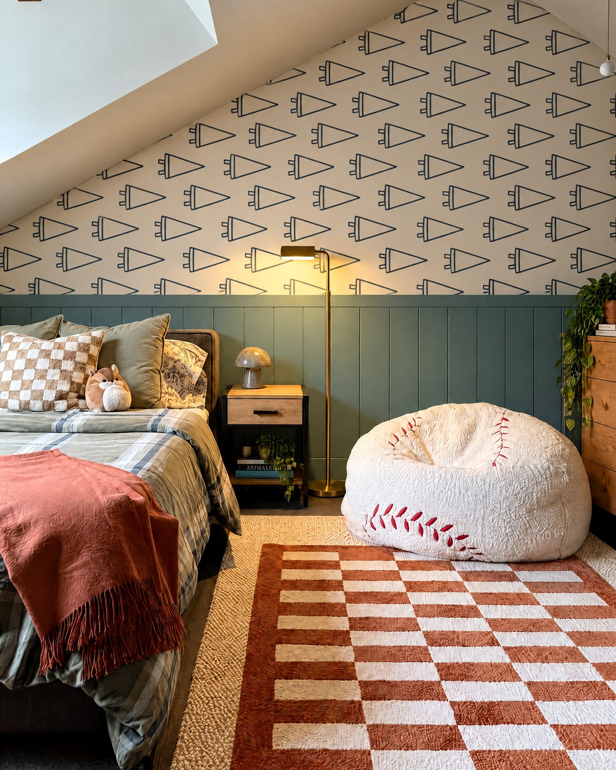 Kids room with navy pennant wallpaper, baseball bean bag and checkered rug