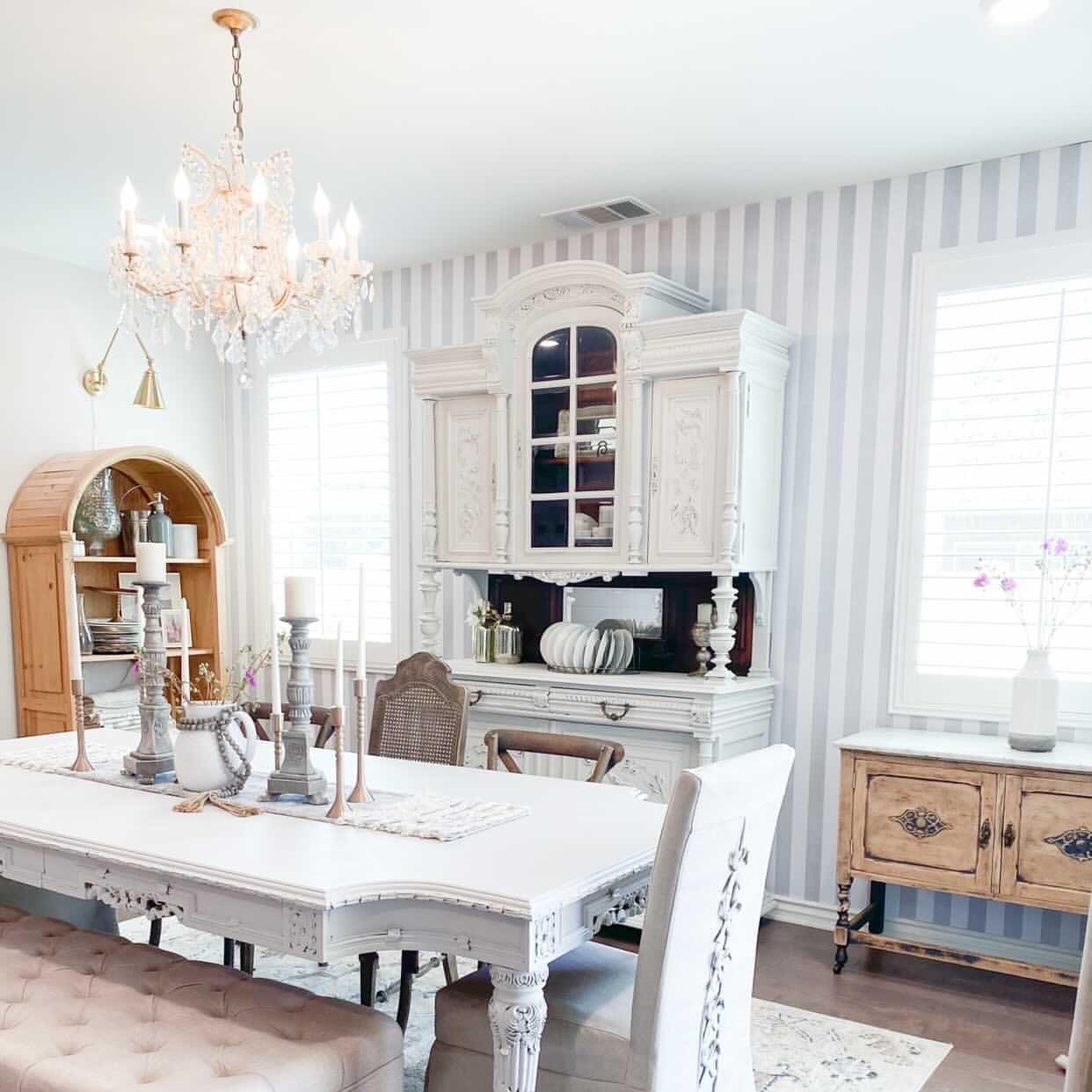 Elegant dining room showcasing Gabbandra Stripes Wallpaper by The 7th Haven Interiors Line.
