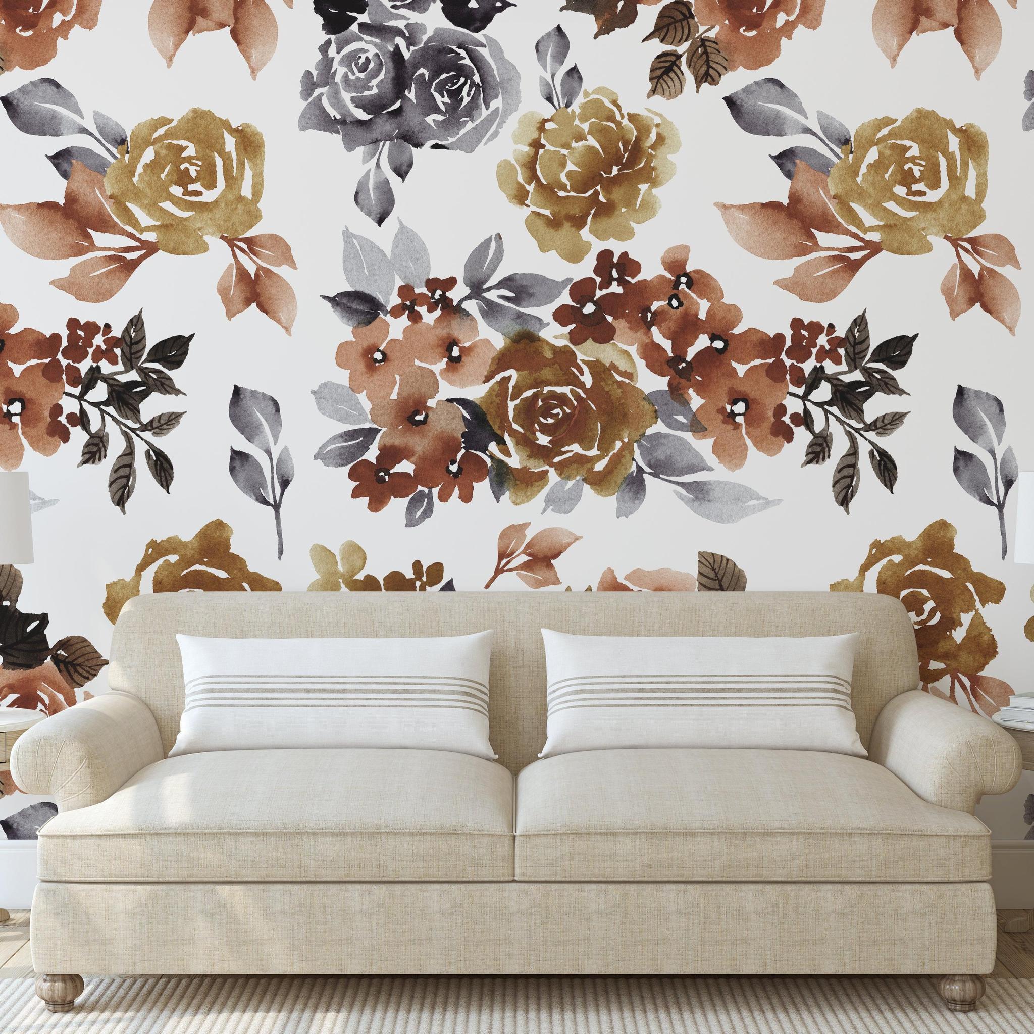 Portland Muted White Wallpaper by The Ania Zwara Line in a cozy living room setting, showcasing floral patterns.
